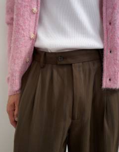 Model wearing Wide leg stripe trouser with pleats in chocolate brown