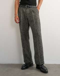 Model wearing Wide leg textured herringbone trouser in black