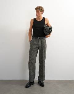 Model wearing Wide leg textured herringbone trouser in black