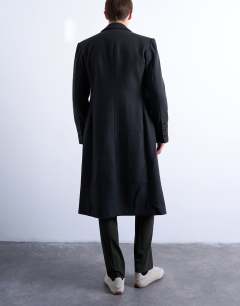 Model wearing Wool blend waisted double breasted overcoat in charcoal