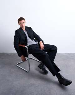 Model wearing Wool blend wide leg striped suit trouser in navy