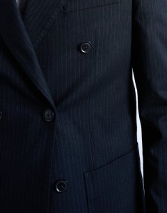 Model wearing Wool touch striped double breasted blazer in navy