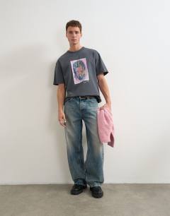 Model wearing Topman x Akilah relaxed fit abstract portrait graphic t-shirt with embroidery in charcoal