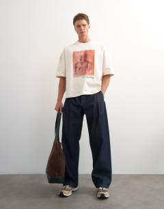 Model wearing X Paul Majek boxy fit crop abstract portrait graphic t-shirt with embroidery in ecru
