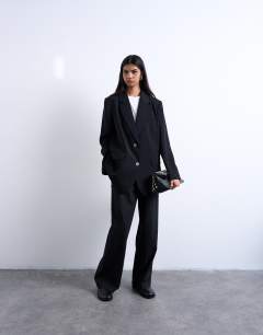 Model wearing 2 button relaxed fit blazer in black