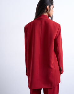 Model wearing 2 button relaxed fit blazer in cherry red