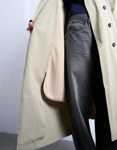 Model wearing 2 in 1 borg trench with detachable lining&nbsp;in stone