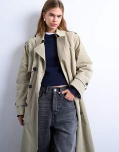 Model wearing 2 in 1 borg trench with detachable lining&nbsp;in stone