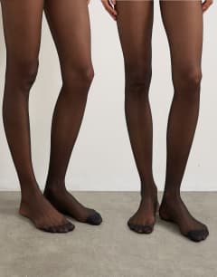Model wearing 2 pack 15 denier tights in black