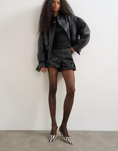 Model wearing 2 pack 15 denier tights in black