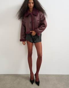Model wearing 2pk 15 denier tights in burgundy