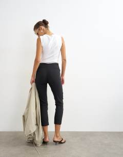 Model wearing 3/4 length capri trouser in black