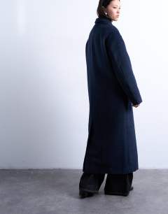 Model wearing 3 button brushed coat with wool in navy