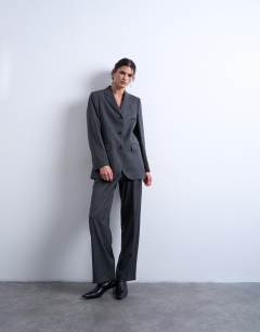 Model wearing 3 button mensy pinstripe blazer co-ord in charcoal