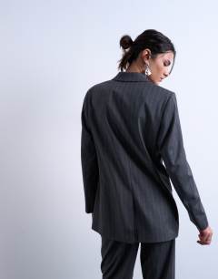 Model wearing 3 button mensy pinstripe blazer co-ord in charcoal