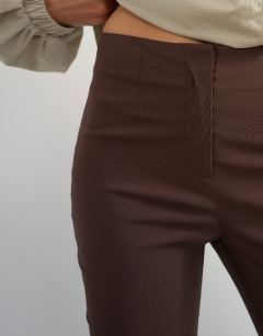 Model wearing 3 quarter length capri in brown