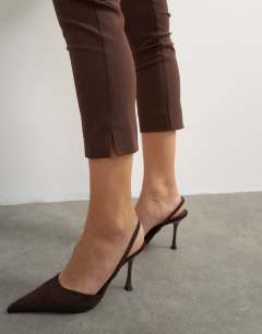 Model wearing 3 quarter length capri in brown