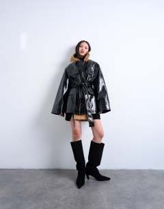 Model wearing 4 pocket vinyl shacket with contrast collar in navy