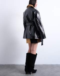 Model wearing 4 pocket vinyl shacket with contrast collar in navy