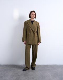 Model wearing 6 button double breasted tuxedo blazer in khaki