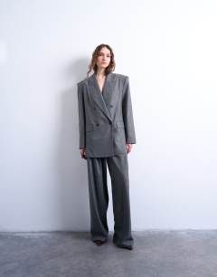 Model wearing 80s double breasted oversized blazer in grey