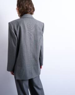 Model wearing 80s double breasted oversized blazer in grey