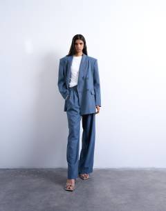 Model wearing 80s double breasted oversized suit blazer in navy
