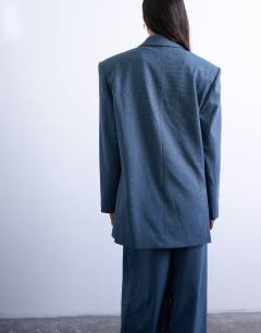 Model wearing 80s double breasted oversized suit blazer in navy