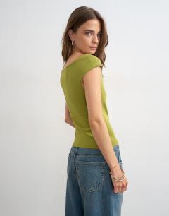 Model wearing 90's boat neck vest in green