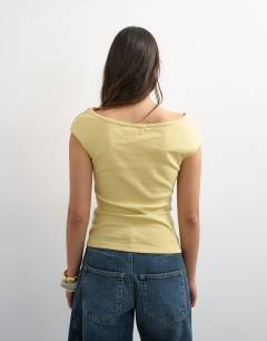Model wearing 90's boat neck vest in soft lime