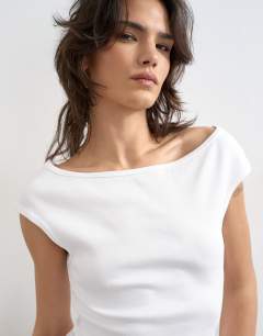 Model wearing 90's boat neck vest in white
