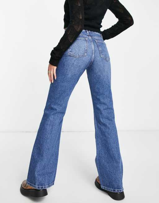 Petite Light Blue Wash Dip Low Rise Flare Jeans