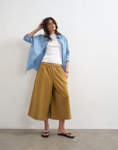 Model wearing A line culotte in tan