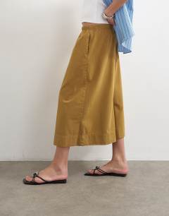 Model wearing A line culotte in tan