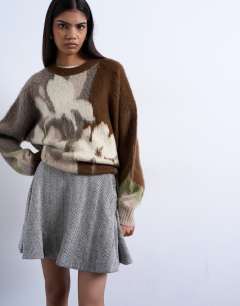 Model wearing A-line flippy mini skirt in mono herringbone