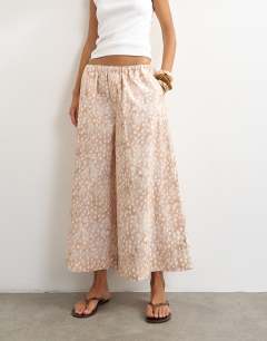 Model wearing A line poplin culotte in  abstract animal print