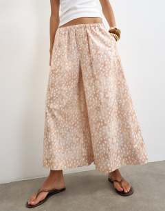 Model wearing A line poplin culotte in  abstract animal print