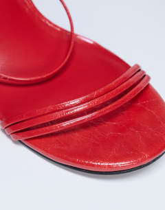 Model wearing Abbie strappy heeled sandal in red