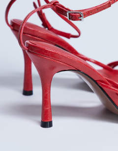 Model wearing Abbie strappy heeled sandal in red