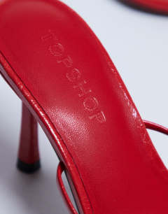 Model wearing Abbie strappy heeled sandal in red