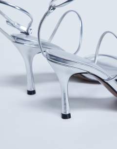Model wearing Abbie strappy mid heel sandal in silver