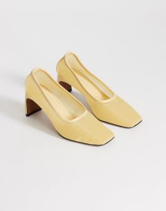Model wearing Abbigail mesh heeled court shoe in buttermilk