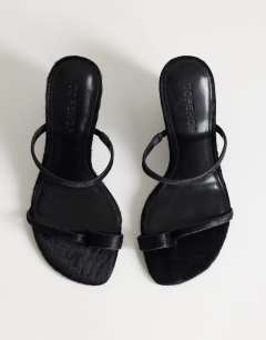 Model wearing Abi strappy wedge heel in black hair on real leather