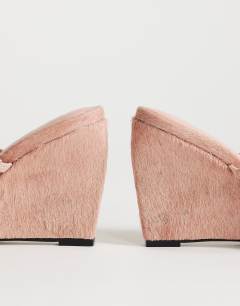 Model wearing Abi strappy wedge heel in pink hair on real leather