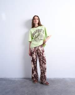 Abstract animal print plisse trousers in brown