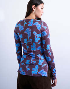 Model wearing Abstract floral print slash neck long sleeve top in blue