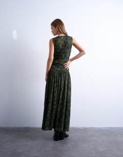 Model wearing Abstract print dropped waist maxi dress in green