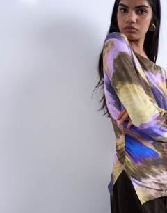 Model wearing Abstract print long sleeve top in purple