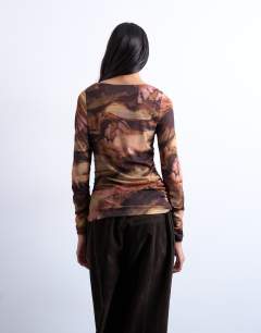 Model wearing Abstract print ruched long sleeve top in multi