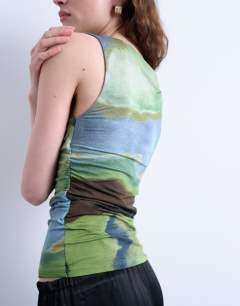 Model wearing Abstract print ruched side tank in green